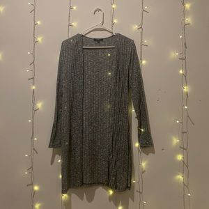 Light long heather gray sweater with slits along sides.